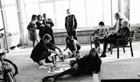 a group of people sitting around a table in a room