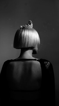 the back of a woman wearing a tiara